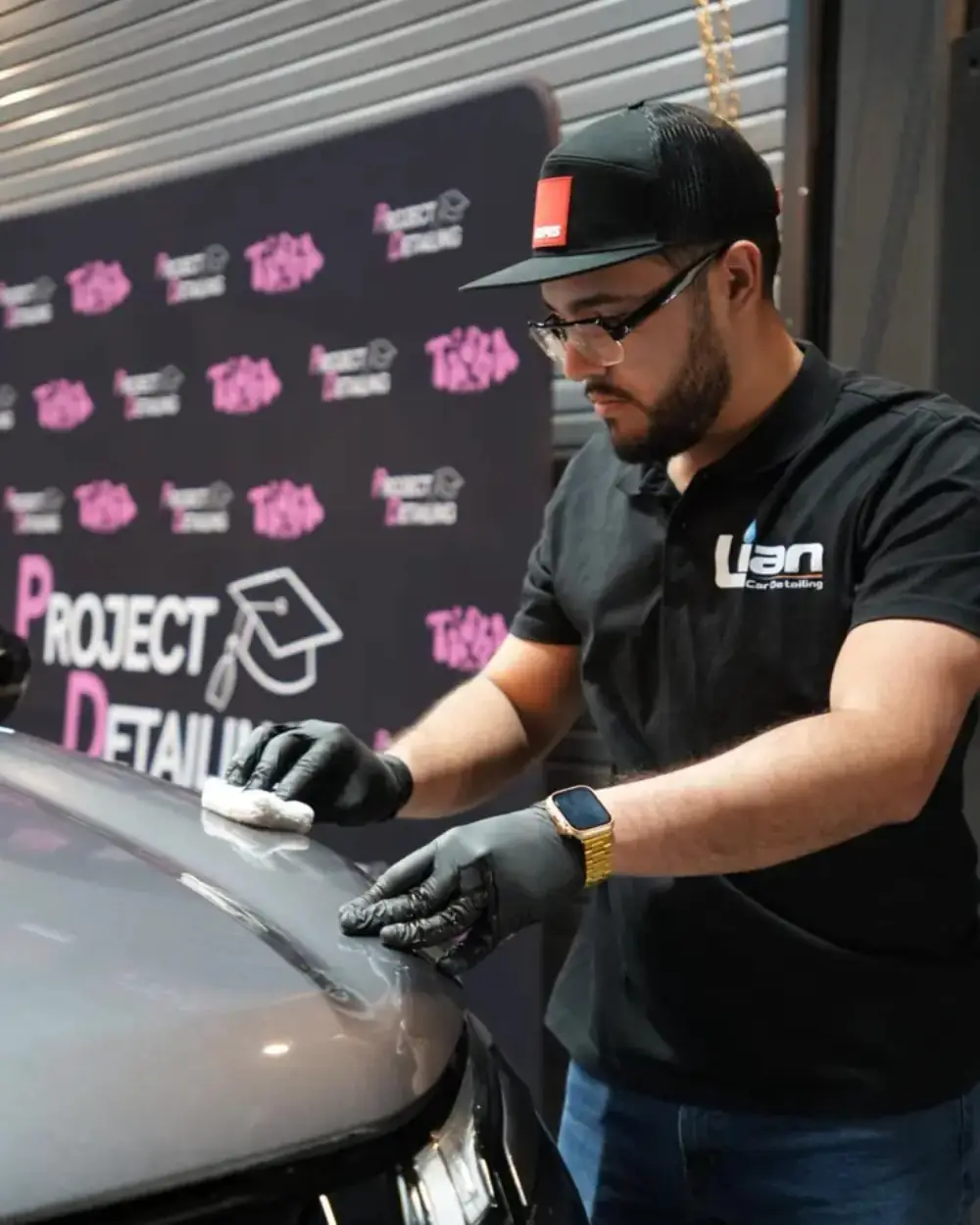 Glossy ceramic-coated black car in Denver, CO